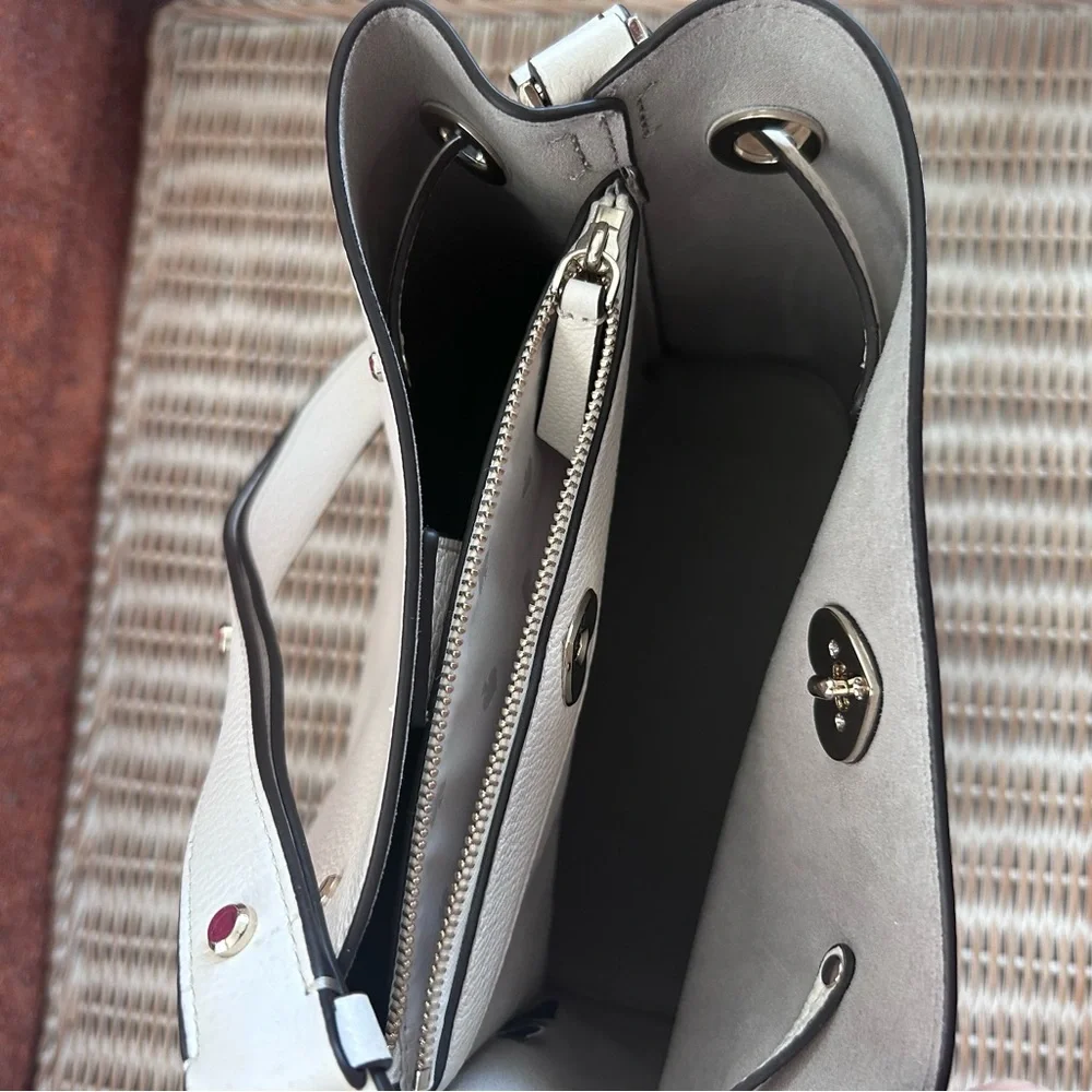 Kate Spade New York Marti large bucket bag in white pebbled leather.